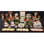 A collection of Devon Torquay mottoware, including plaque, candlesticks, cheese dish, vases, etc,