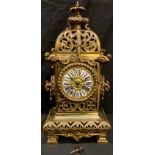 A French gilt bronze mantel clock, Roman numerals, key and pendulum, 48cm high