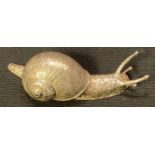 An Elizabeth II cast silver model of a snail, 6cm long, Birmingham 1995