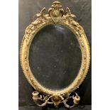 An early 19th century oval gilt girandole looking glass, 87cm high