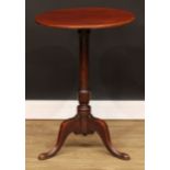 A mahogany tripod occasional table, circular top, cannon barrel column, cabriole legs, pointed pad