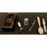 A Toleware snuff box; an agate seal; a pencil; a silver thimble; etc
