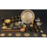 An early 20th century brass car fire extinguisher, a brass school bell, brass jam pan, copper ladle,