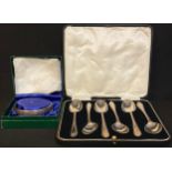 A set of six silver teaspoons, Sheffield 1930, cased; a silver bangle, Birmingham 1979, boxed; 111g