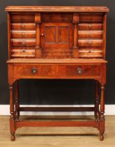 A Biedermeier flame mahogany architectural collector’s cabinet, rectangular top with convex-