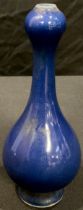 A Chinese blue glazed onion top bottle vase, 17cm high