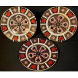 A pair of Royal Crown Derby Imari palette 1128 pattern tea plates, another similar, printed marks,