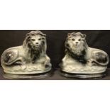 A pair of Victorian Staffordshire mantel lions, glass eyes, 23cm high