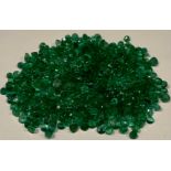 Gem Stones - a collection of mostly uniform loose faceted emeralds, 13.7g