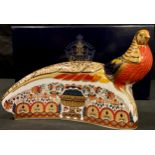 A Royal Crown Derby paperweight, The Golden Pheasant, gold stopper, printed mark, boxed