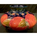 A Moorcroft Pomegranate pattern compressed ovoid vase, 12.5cm, impressed marks, signature in green