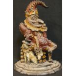 A 19th century cold painted cast iron door stop modelled as Punch with his dog, Toby, 32cm high