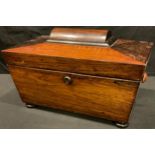 A Victorian rosewood sarcophagus tea caddy, hinged cover enclosing a pair of lidded compartments,