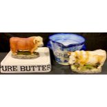 Interior Decoration - a two handled blue and white cream crock; a shop display butter stand; a