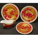 A set of three Royal Crown Derby Red Aves pattern graduating plates, heraldic border; a similar