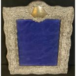 A Victorian arched silver photograph frame, bevelled glass, 32cm