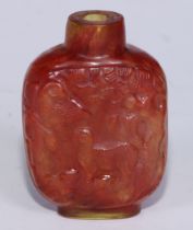 A Chinese hardstone snuff bottle, carved with birds, figures and woodland animals beneath a leafy