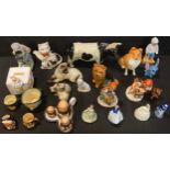 A Sylvac model of a Collie dog, number 5023; a Sylvac model of a terrier; two Beswick cat groups;
