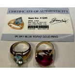 A 9ct gold pear cut topaz ring, size P, marked 375, 5g, certificate; a 10k gold red stone dress