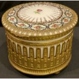 A French Empire Style circular porcelain gilt brass mounted musical box, hinged cover, two airs,