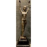 After Agathon Leonard, an Art Deco style dancing girl, her hands raised, signed in the maquette,