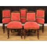 A set of five late Victorian oak dining chairs, each with an arched cresting rail carved in the 17th