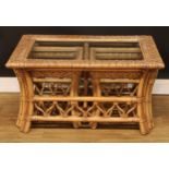 A bamboo and rattan coffee table nest, the largest 48cm high, 95cm wide, 69cm deep, the occasional