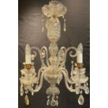 A 20th century clear glass five light ceiling light, S scroll arms, prismatic droppers, 65cm high
