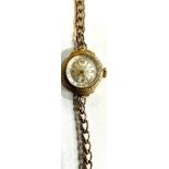 A lady's 9ct gold Avia watch, champagne dial with baton indicators, Arabic numerals to quarters,