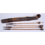 Tribal Art - an African boran hide quiver and cover, enclosing four bamboo arrows, various shapes