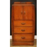 An Art Deco oak and veneer press cupboard, of small proportions, half-gallery above a pair of
