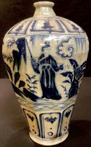 A Korean style octagonal inverted baluster blue and white vase, painted with a continuous garden