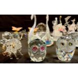 A Swarovski crystal owl, other unmarked crystal animals, elephant, dogs, swans, owls, etc; a pair of