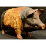 A cast metal painted piggy bank, 46cm wide