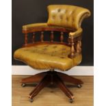 A Victorian style swivel office chair, 86.5cm high, 64cm wide, the seat 51cm wide and 43cm deep