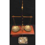 A 19th century mahogany and brass apothecary balance scale and weights, c.1870