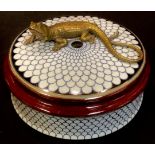 A Continental porcelain circular box and cover, the cover mounted with a bronzed metal lizard,
