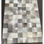 A contemporary rug or carpet, 292cm x 237cm