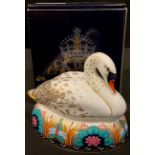 A Royal Crown Derby paperweight, White Swan, gold stopper, printed marks in red, boxed