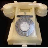 A white Bakelite dial up telephone "Call Exchange" , with sliding drawer for contact numbers,