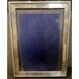 A sterling silver rectangular easel photograph frame, 18x13cm