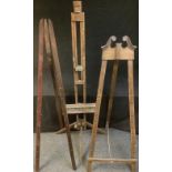 A large artist's easel 160cm; two other display easels, 164cm (3)