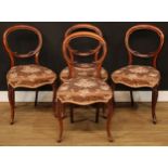 A set of four Victorian walnut balloon back dining chairs, cabriole legs, 84cm high, 45cm wide,