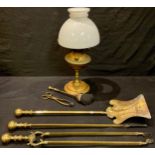 A Hink's No. 2 brass oil lamp; a brass three piece fireside companion set; etc (6)