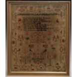 A George IV needlework sampler, by Maria Woodhead, 1823, worked in coloured threads with alphabet,