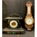 A late 19th century French black slate architectural mantel clock, set with three polished malachite