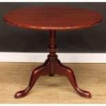 A George III style mahogany tripod occasional table, circular tilting top, turned column, cabriole