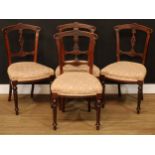 A set of four Victorian Aesthetic Movement dining chairs, 86cm high, 46cm wide, the seat 35cm