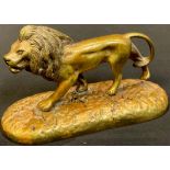 French School (early 20th century), a gilt bronze, of a lion, oval base, 12.5cm long