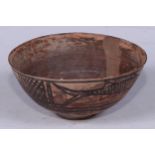 An Indus Valley terracotta bowl, the exterior decorated with fish divided by crosshatch panels,